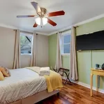 Vibrant, Colorful Condo Building With Backyard Firepit And Games