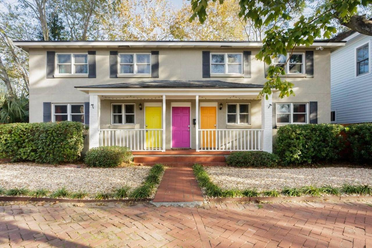 Vibrant, Colorful Building With Backyard Firepit And Games Apartment